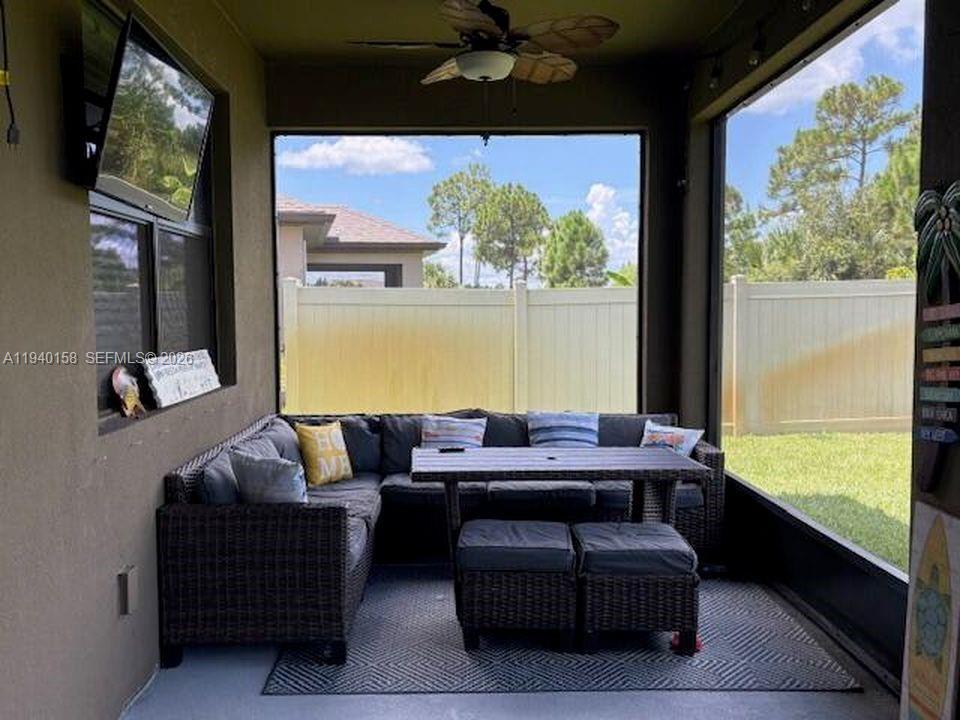 571 Old Country Rd S East Palm Bay, FL 32909 - Photo 22 of 29 a living room with furniture and a large window