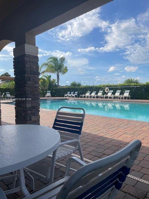 571 Old Country Rd S East Palm Bay, FL 32909 - Photo 23 of 29 a view of a patio with wooden floor and city view