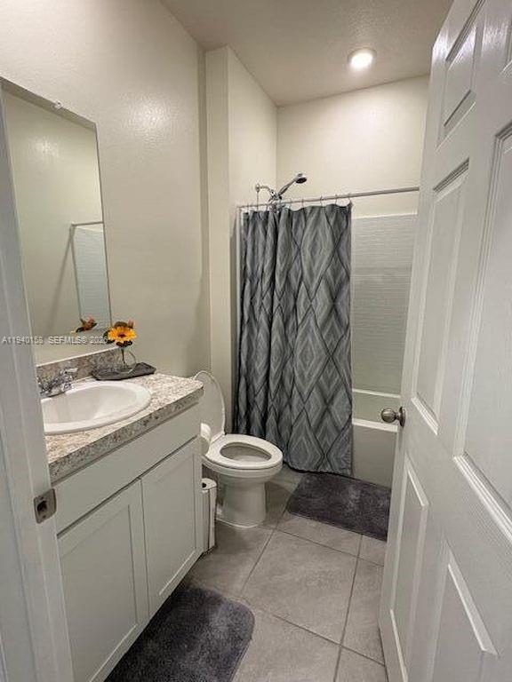 571 Old Country Rd S East Palm Bay, FL 32909 - Photo 25 of 29 a bathroom with a granite countertop sink toilet and shower