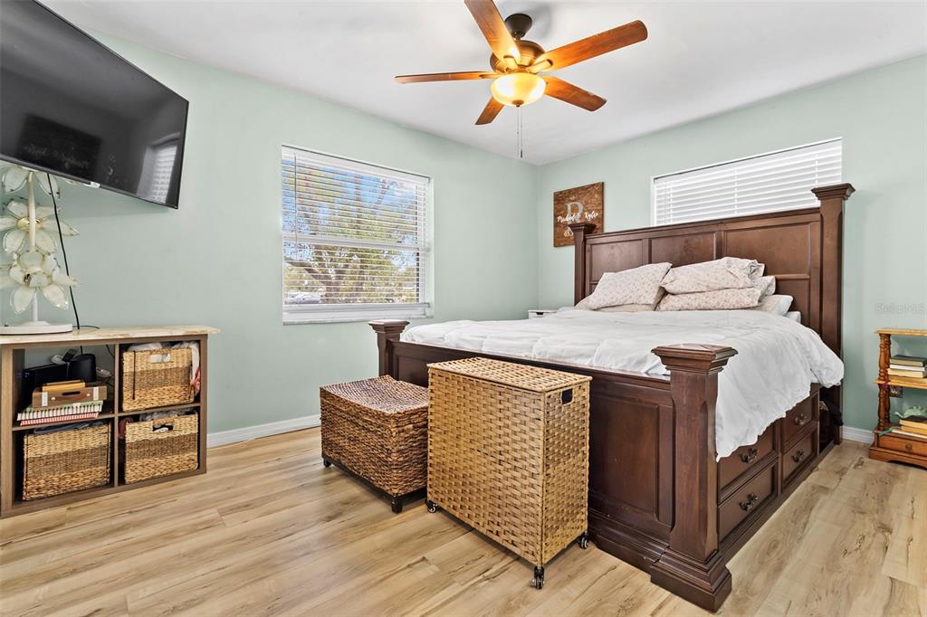 6221 Dalton Street Spring Hill, FL 34606 - Photo 17 of 40 a bedroom with a bed and a flat screen tv