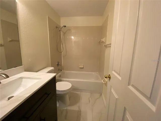 a view of an empty room with windows