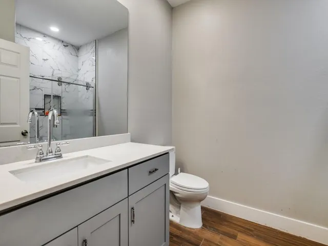 a bathroom with a shower and a shower