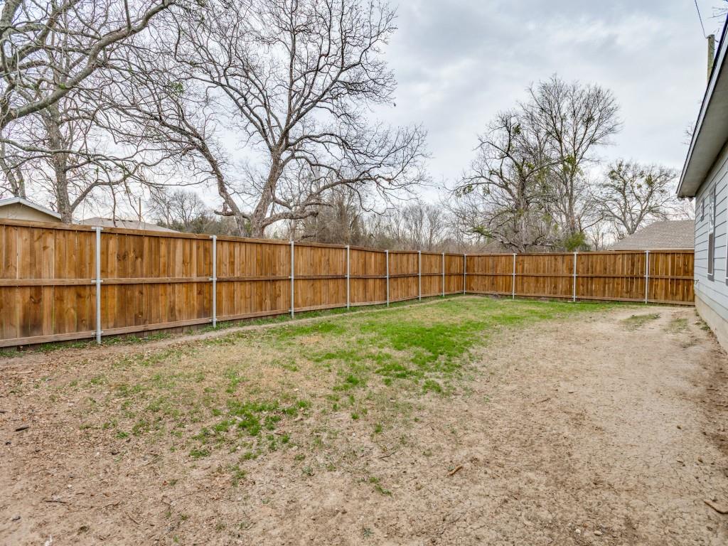 908 East Decatur Street Ennis, TX 75119 - Photo 21 of 22 a view of backyard with wooden fence