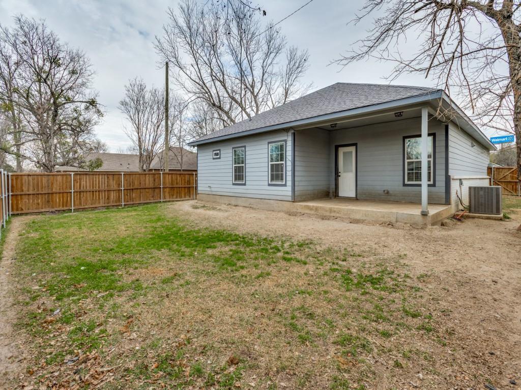 908 East Decatur Street Ennis, TX 75119 - Photo 22 of 22 a house that has a backyard