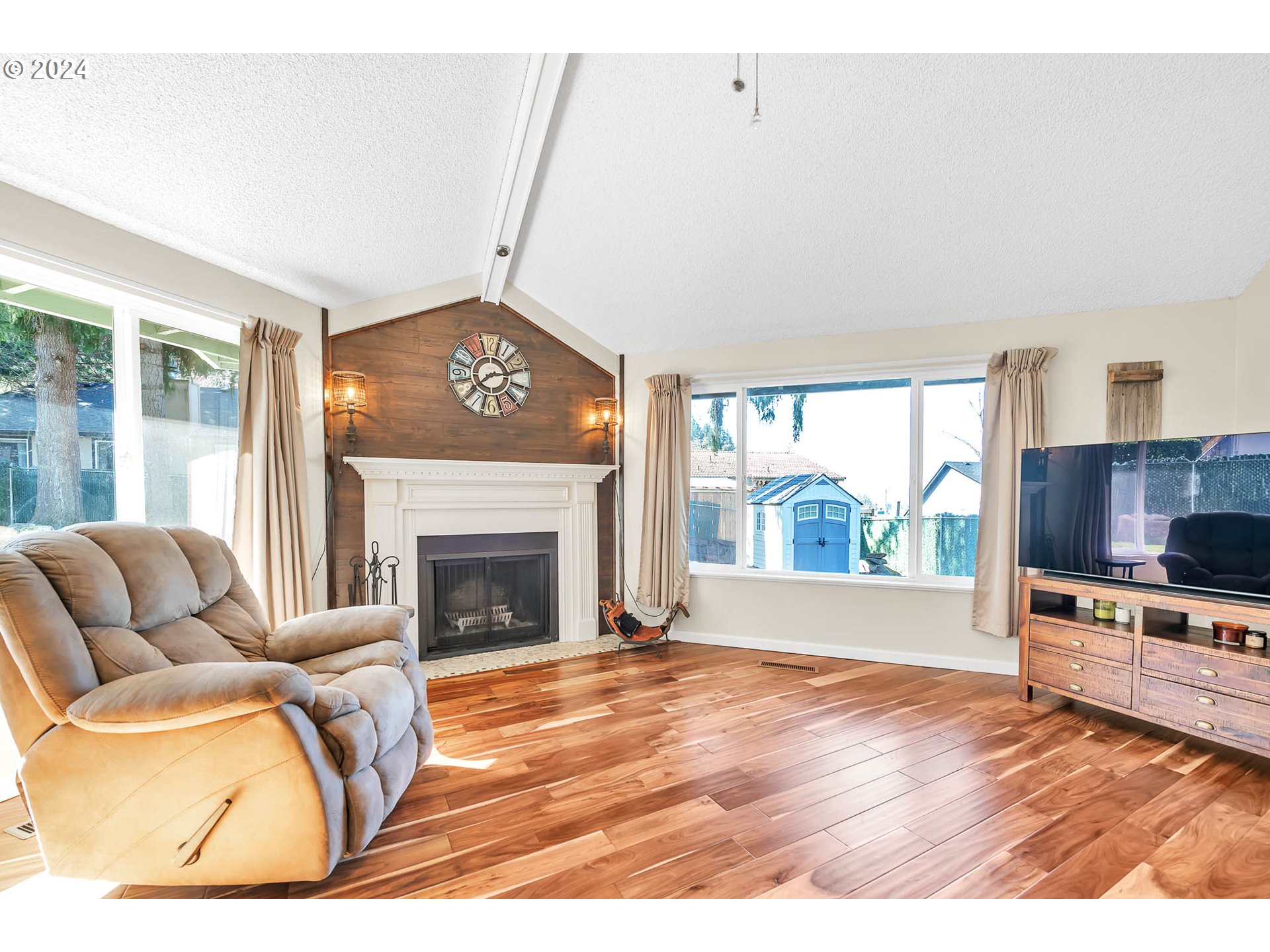 568 South 68th Place Springfield, OR 97478 - Photo 14 of 44 a living room with furniture and a fireplace