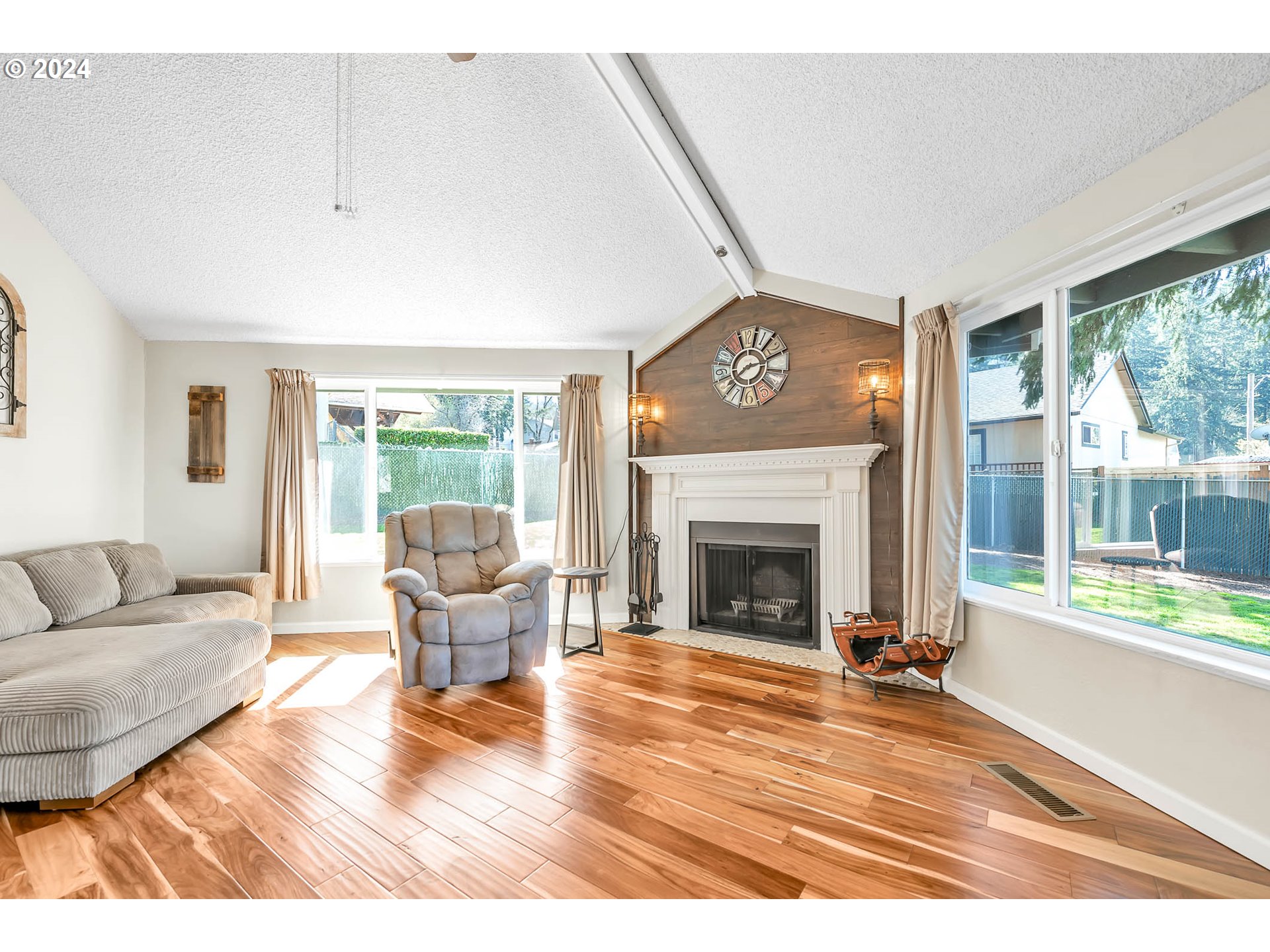 568 South 68th Place Springfield, OR 97478 - Photo 15 of 44 a living room with furniture and a fireplace