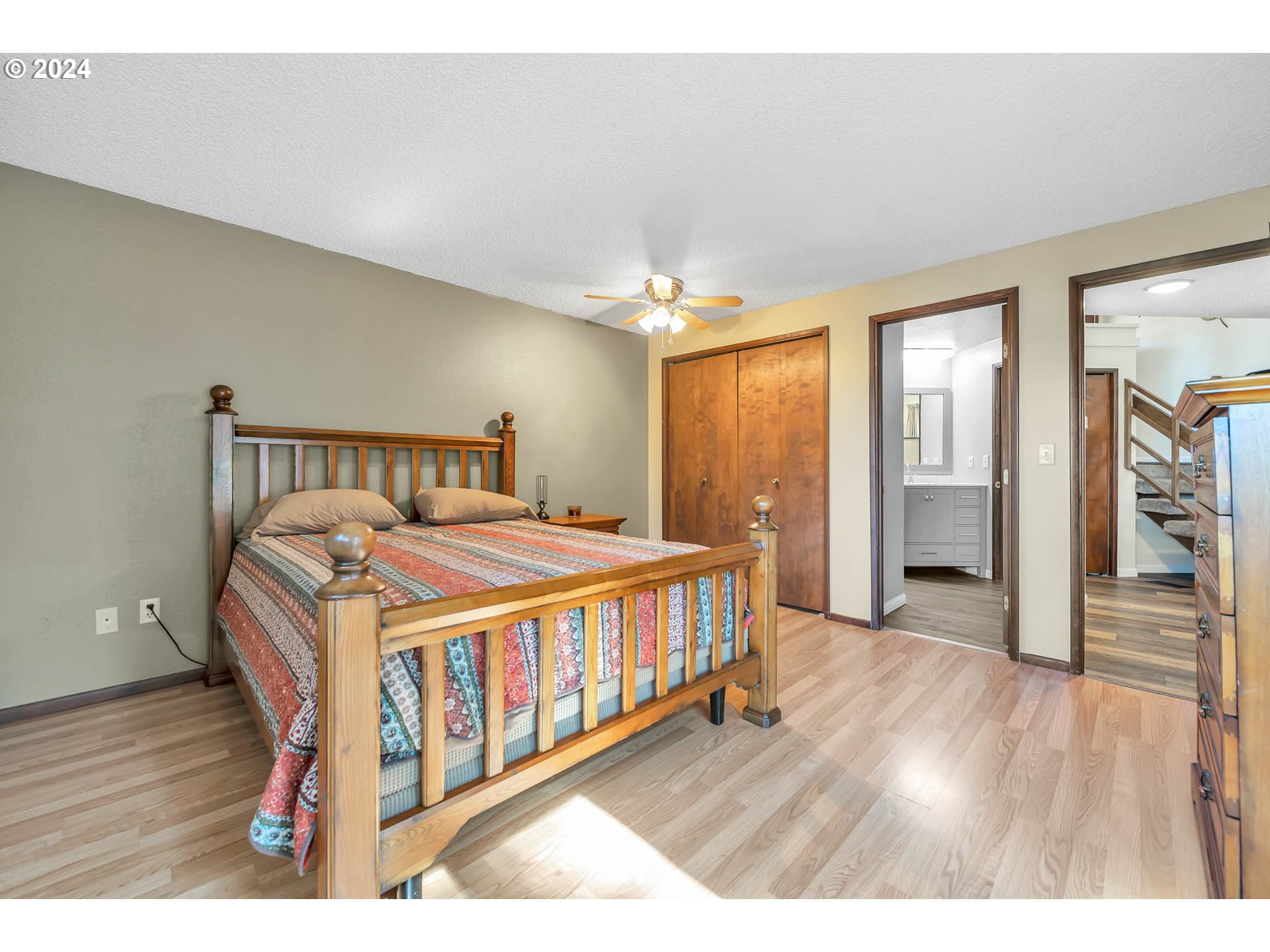 568 South 68th Place Springfield, OR 97478 - Photo 28 of 44 a bedroom with a bed and wooden floor