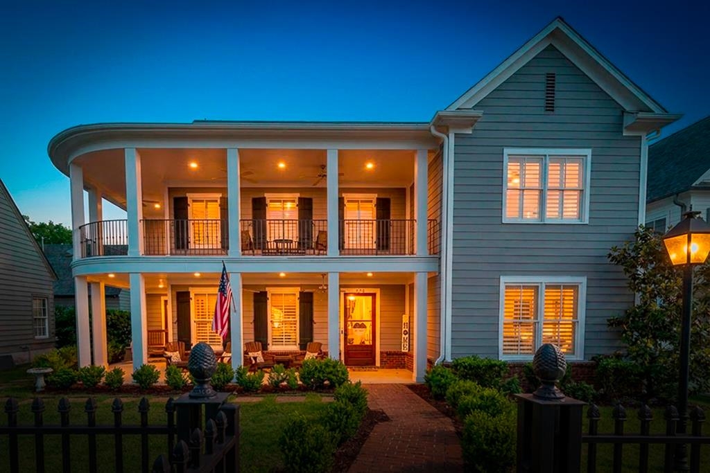328 Washington Street Collierville, TN 38017 - Photo 1 of 33 Two-story residence featuring a curved porch and balcony with black railings