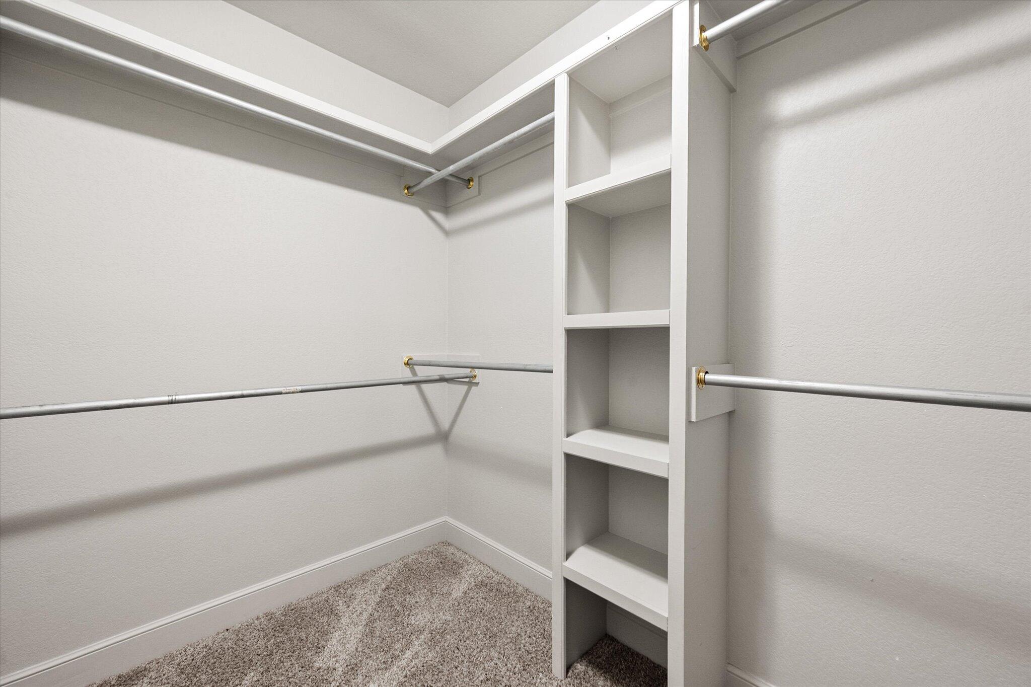 4916 Itasca Street Lubbock, TX 79416 - Photo 17 of 27 a view of walk in closet with empty racks