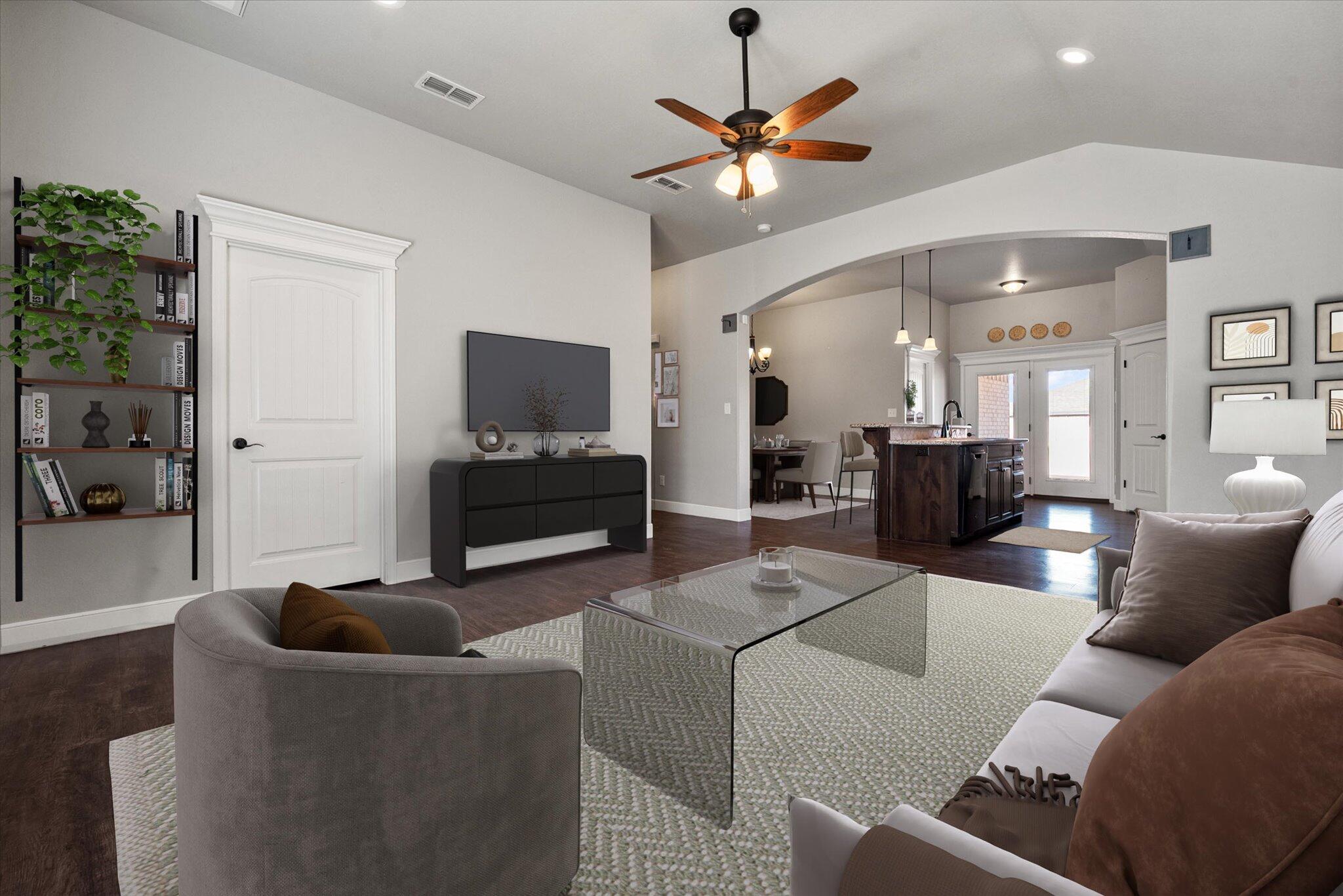 4916 Itasca Street Lubbock, TX 79416 - Photo 5 of 27 a living room with furniture and a flat screen tv