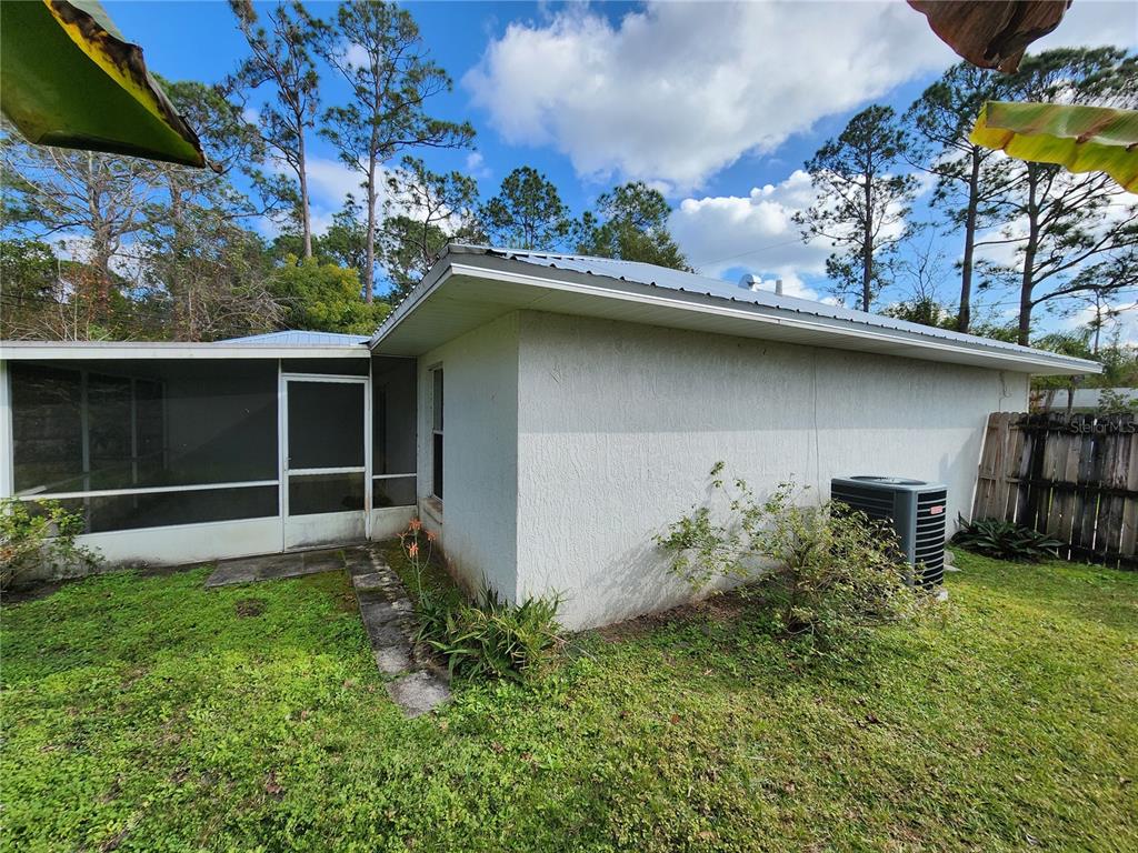 38 General Doolittle Road Daytona Beach, FL 32124 - Photo 3 of 19 a backyard of a house with table and chairs