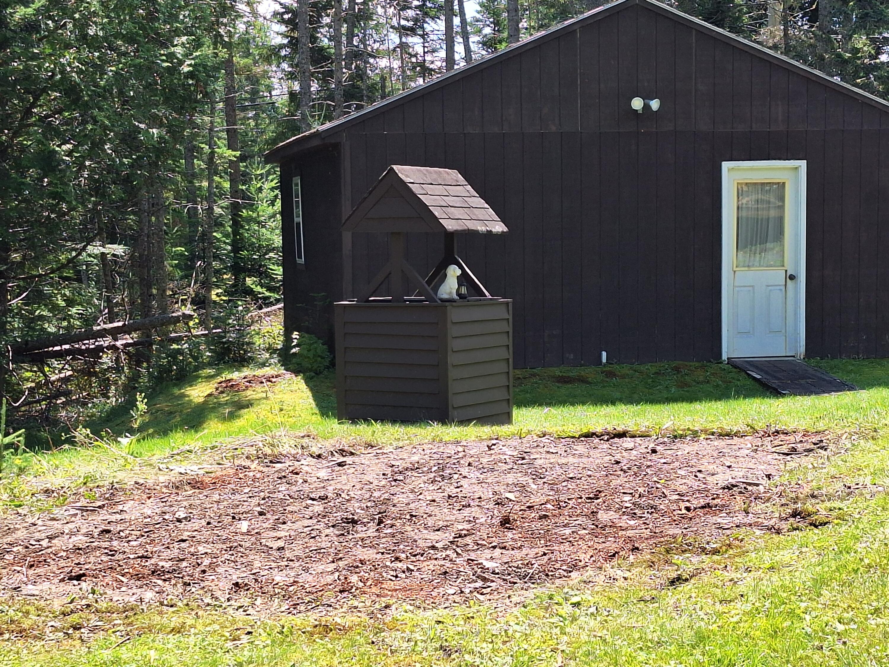 17 Summer Road Rangeley, ME 04970 - Photo 7 of 45 garage, well and space for woodshed
