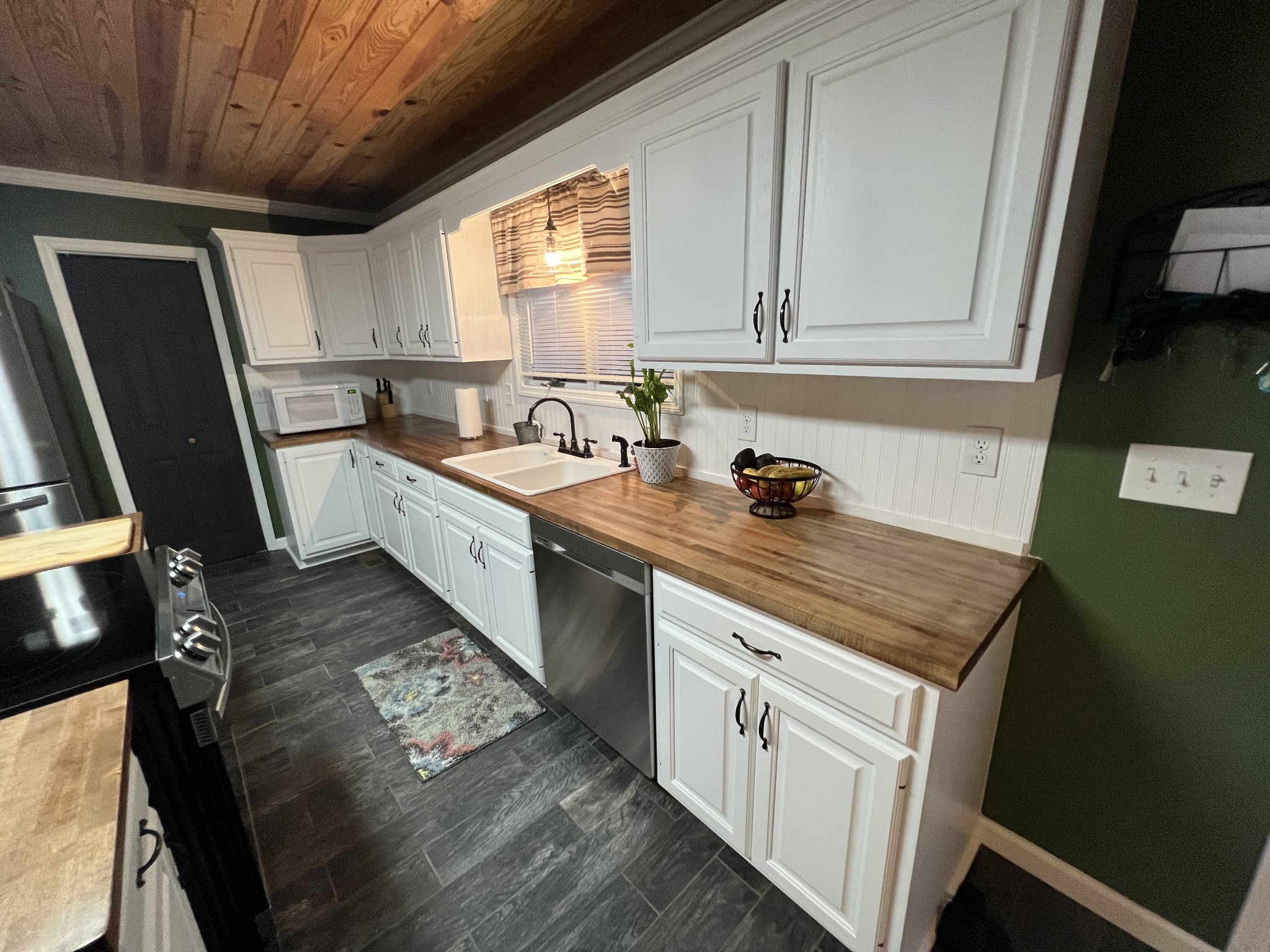 538 Dotson Cemetery Road Decherd, TN 37324 - Photo 29 of 70 a kitchen with a sink stove and cabinets