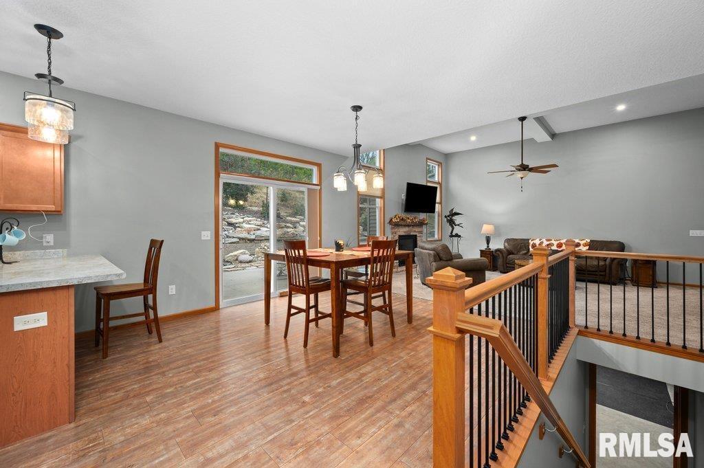 1215 Waverly Road Davenport, IA 52804 - Photo 12 of 34 a view of a dining room with furniture window and wooden floor