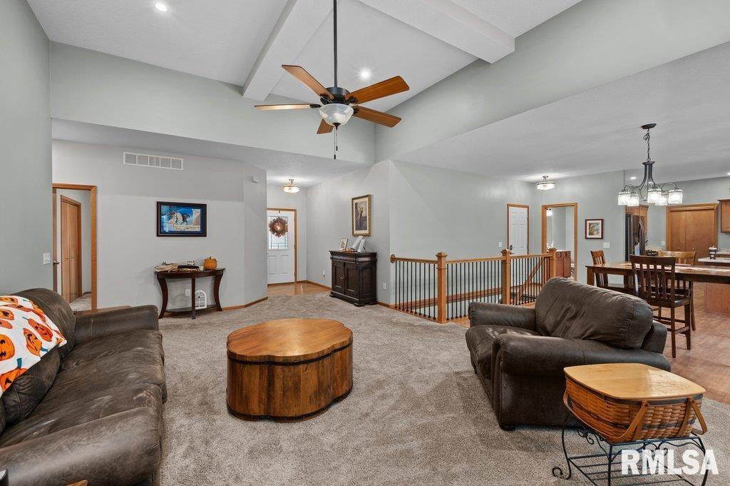 1215 Waverly Road Davenport, IA 52804 - Photo 17 of 34 a living room with furniture and a table
