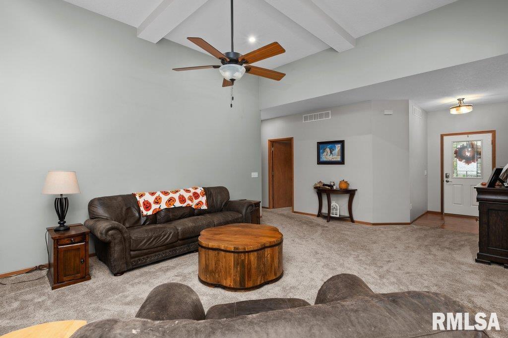 1215 Waverly Road Davenport, IA 52804 - Photo 18 of 34 a living room with furniture and a flat screen tv
