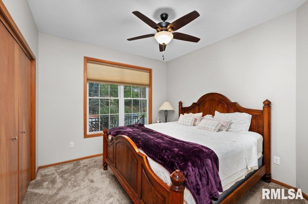 1215 Waverly Road Davenport, IA 52804 - Photo 20 of 34 a spacious bedroom with a bed and a large window