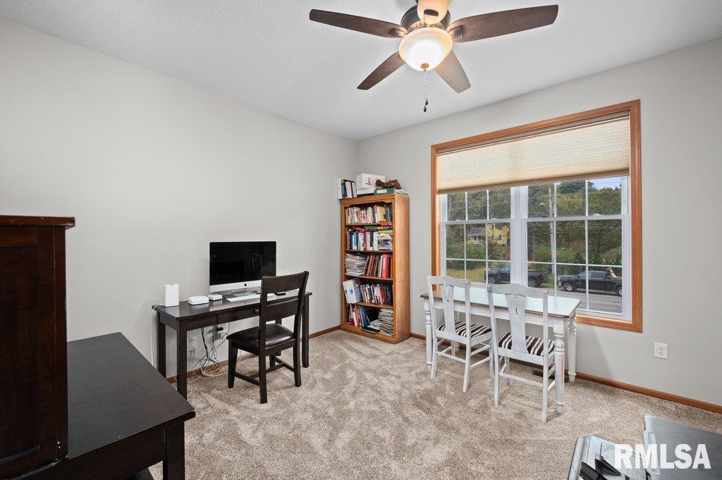1215 Waverly Road Davenport, IA 52804 - Photo 21 of 34 a view of a workspace with furniture and a window