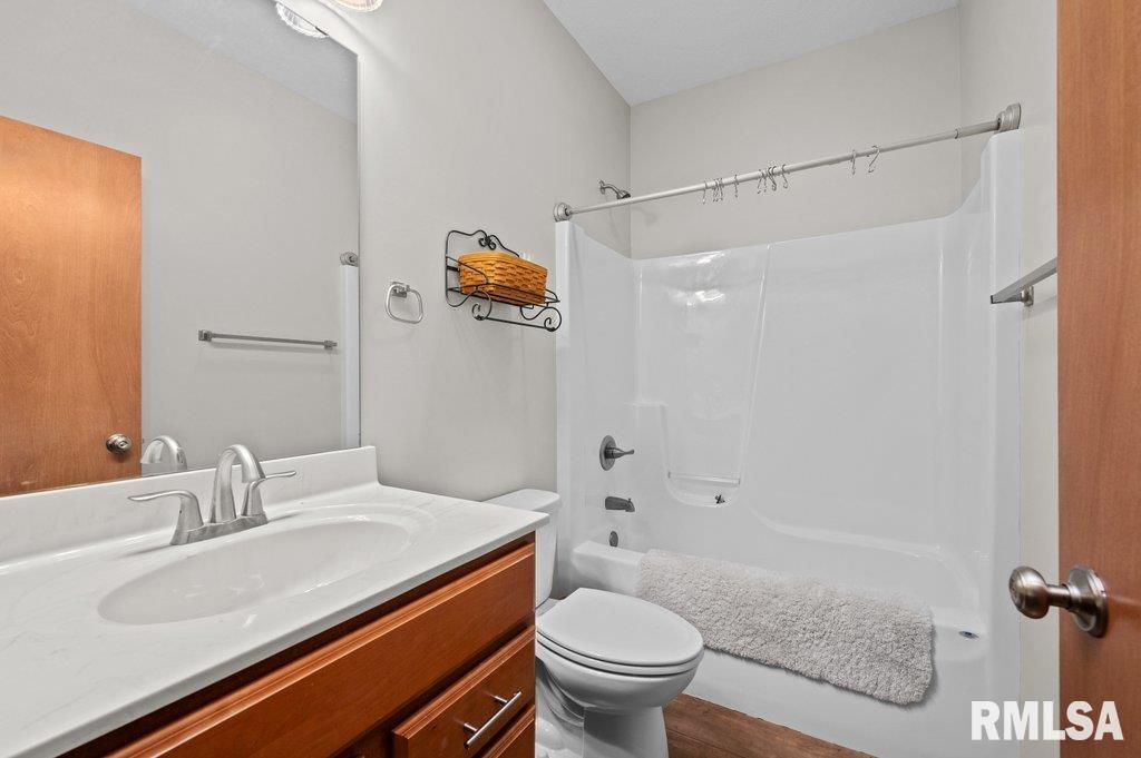 1215 Waverly Road Davenport, IA 52804 - Photo 23 of 34 a bathroom with a sink toilet and shower