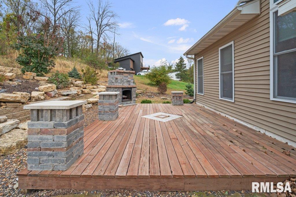 1215 Waverly Road Davenport, IA 52804 - Photo 32 of 34 a view of backyard with a deck and wooden floor
