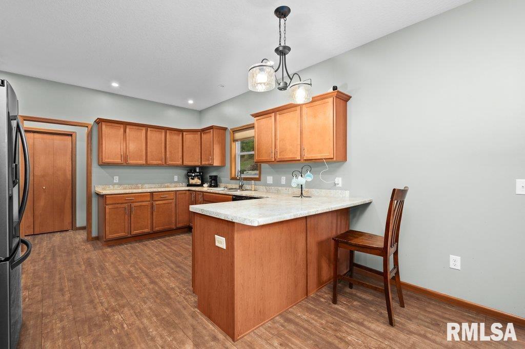 1215 Waverly Road Davenport, IA 52804 - Photo 6 of 34 a kitchen with a sink appliances and cabinets