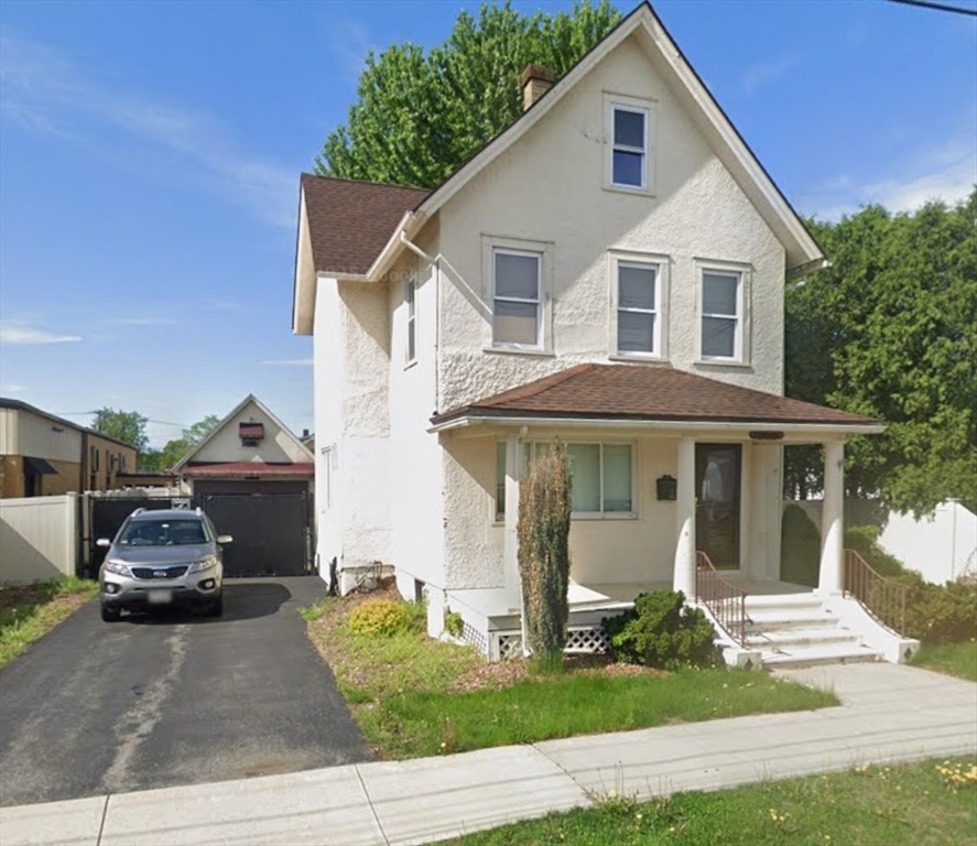 122 Norman Street West Springfield, MA 01089 - Photo 1 of 28 a view of a white house with a yard and plants