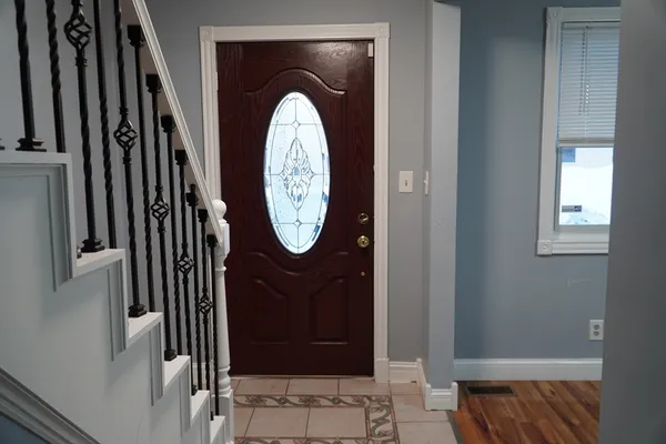 an empty room with wooden floor