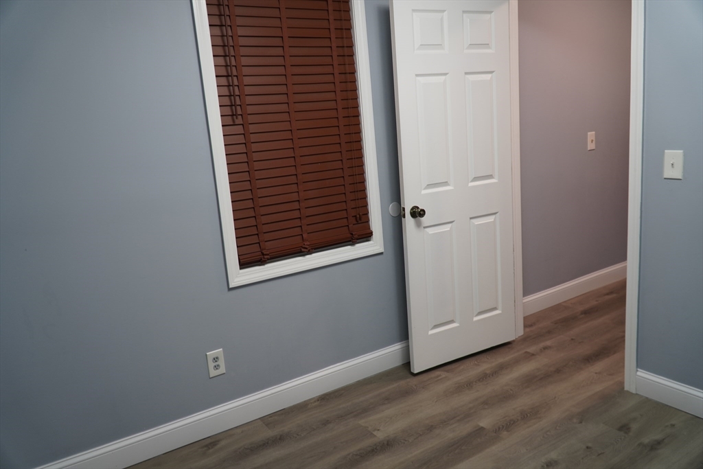 122 Norman Street West Springfield, MA 01089 - Photo 18 of 28 an empty room with wooden floor