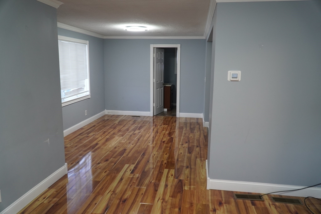 122 Norman Street West Springfield, MA 01089 - Photo 4 of 28 a view of wooden floor in an empty room
