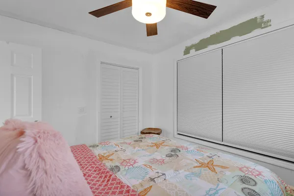 a bedroom with a bed and a dresser