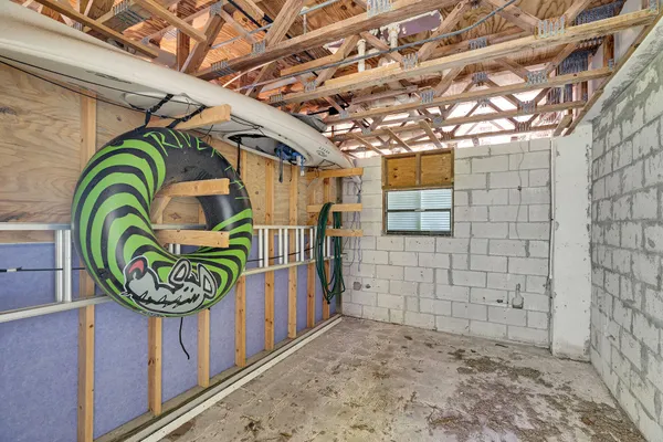 a bedroom with a bed a table and chair