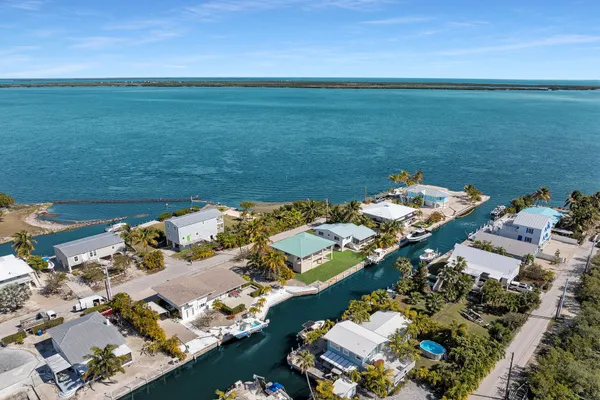 an aerial view of a houses with outdoor space