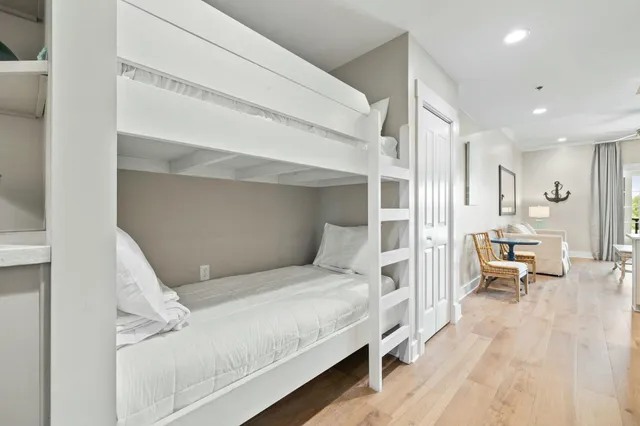 a bathroom with a bathtub and a walk in closet