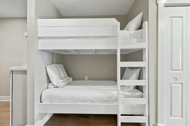a bedroom with a bed and walk in closet