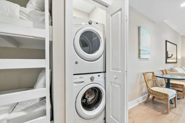 a view of a hallway with washer and dryer