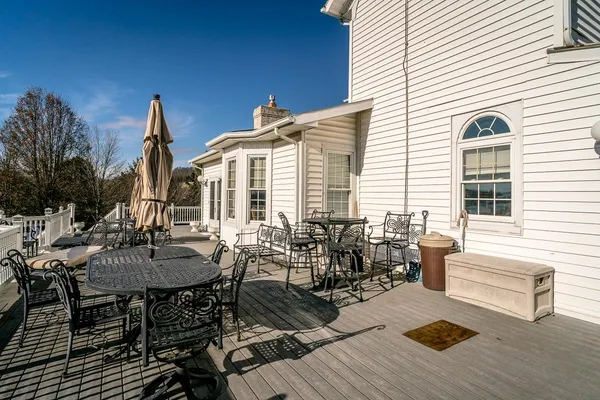 a view of a dinning table and chairs in the patio