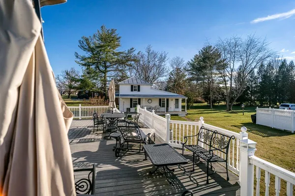 swimming pool view with a seating space