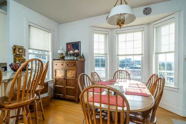 a view of a dining room with furniture window and outside view