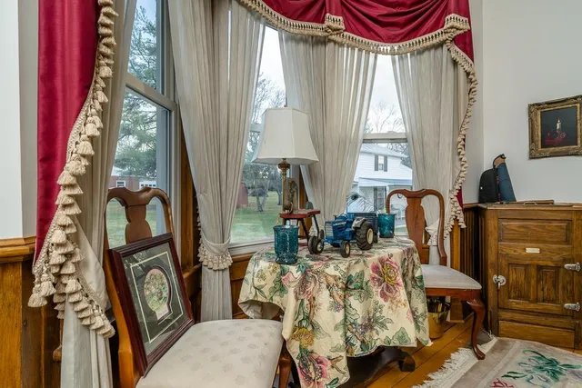 a view of a balcony with furniture and a window