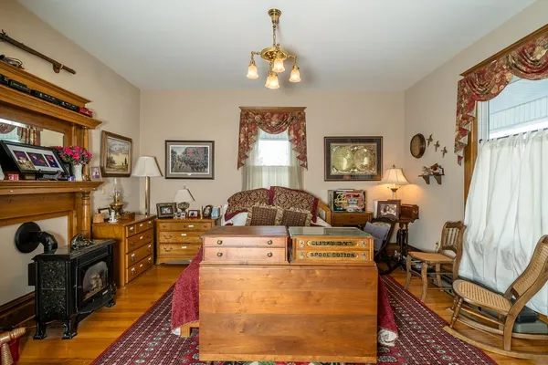 a living room with furniture and a chandelier