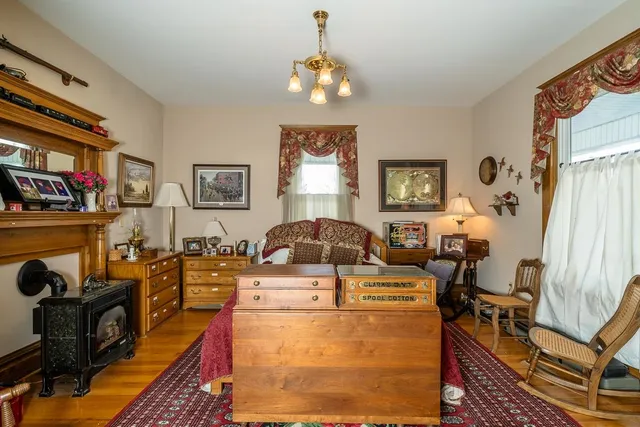 a living room with furniture and a chandelier