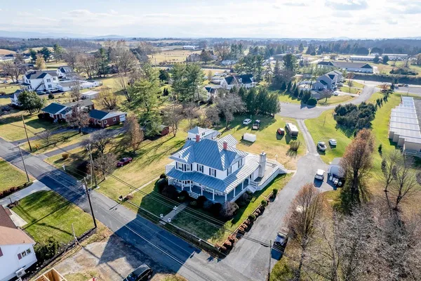 an aerial view of a house with a garden