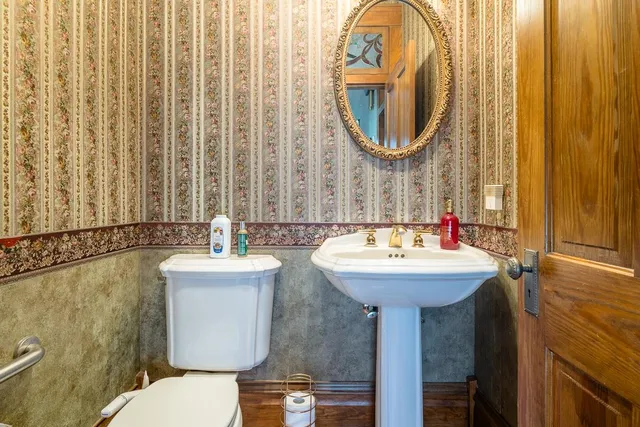 a view of a livingroom with furniture window and wooden floor
