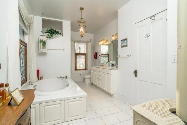 a bathroom with a tub and shower