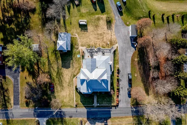 an aerial view of houses with outdoor space