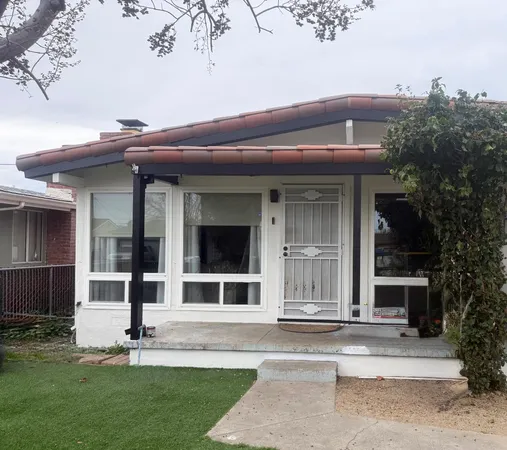 a view of front a house with a yard