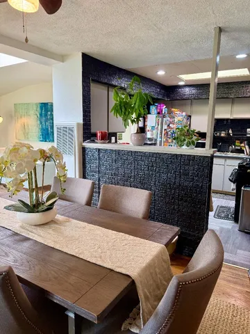 a bedroom with a bed a table and chair