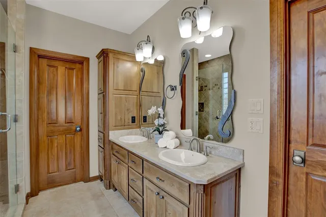 a bathroom with a sink vanity and a mirror