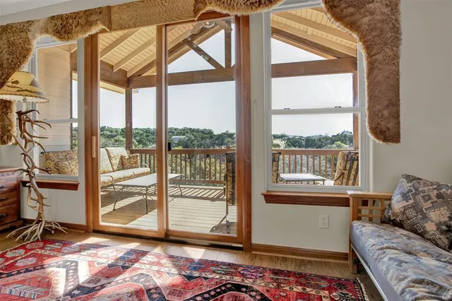 a living room with a couch and next to a window