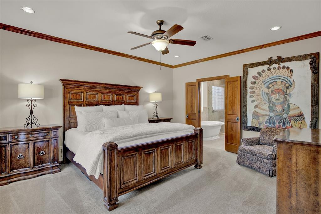 5300 Lookout Ridge Drive Marble Falls, TX 78654 - Photo 20 of 40 a spacious bedroom with a bed and ceiling fan